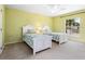 Twin bedroom boasting two twin beds, ceiling fan, and a window with natural light at 2496 Farms Ct, Sarasota, FL 34240