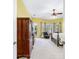 This primary bedroom has room for a seating area and features a ceiling fan and outdoor access at 2496 Farms Ct, Sarasota, FL 34240