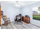 Bright room featuring a desk, ceiling fan and a wooden rocking chair at 2496 Farms Ct, Sarasota, FL 34240
