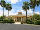 Inviting community clubhouse with manicured landscaping and convenient ramp access at 2496 Farms Ct, Sarasota, FL 34240