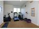 Well-equipped exercise room with treadmill, stationary bicycle, and room for floor exercises at 2496 Farms Ct, Sarasota, FL 34240