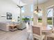 Spacious living room with high ceilings, a ceiling fan, and plenty of natural light at 2496 Farms Ct, Sarasota, FL 34240