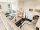 Aerial view showcasing open layout between the kitchen, living room, and dining area, filled with natural light at 2496 Farms Ct, Sarasota, FL 34240
