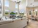 Open-concept living room offers ample seating and a view of the screened lanai and backyard at 2496 Farms Ct, Sarasota, FL 34240