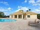 Relaxing community pool area with comfortable lounge chairs and a charming building, perfect for leisurely days at 2496 Farms Ct, Sarasota, FL 34240