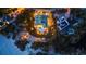Stunning aerial view showcasing a luxurious home with a backyard pool, complemented by manicured landscaping and ambient lighting at 26 Sandy Hook S Rd, Sarasota, FL 34242