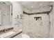 This modern bathroom features a glass enclosed shower with stylish tile and a sleek vanity at 26 Sandy Hook S Rd, Sarasota, FL 34242