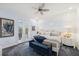 Relaxing bedroom retreat features serene decor, bright windows, and a decorative ceiling fan at 26 Sandy Hook S Rd, Sarasota, FL 34242