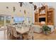 Open-concept living and dining area with hardwood floors, large windows, and beach views at 26 Sandy Hook S Rd, Sarasota, FL 34242