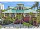 Beautiful two-story home with tropical landscaping and a grand entrance at 26 Sandy Hook S Rd, Sarasota, FL 34242
