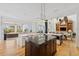 Bright kitchen with a center island, granite countertops, and stainless steel appliances at 26 Sandy Hook S Rd, Sarasota, FL 34242