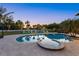 Inviting pool and spa area with beach views and colorful Adirondack chairs at 26 Sandy Hook S Rd, Sarasota, FL 34242