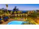 Aerial view of the pool, landscaping, and outdoor seating area near the ocean at 26 Sandy Hook S Rd, Sarasota, FL 34242