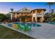 Backyard oasis with a private pool, comfortable seating, and a serene outdoor living space at 26 Sandy Hook S Rd, Sarasota, FL 34242