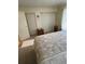 Bright bedroom with ample closet space, carpeted floors, and a cozy ambiance at 2624 Hidden Lake Dr N # C, Sarasota, FL 34237