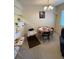 Functional dining space with a cozy atmosphere and a view into the adjacent kitchen area at 2624 Hidden Lake Dr N # C, Sarasota, FL 34237