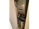 Utility closet containing a hot water heater and HVAC unit at 2624 Hidden Lake Dr N # C, Sarasota, FL 34237