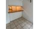 Compact breakfast bar featuring granite countertop and tile flooring at 2733 Hidden Lake Blvd # A, Sarasota, FL 34237