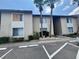 Multi-Gathering apartment building with parking, landscaping, and palm trees on a sunny day at 2733 Hidden Lake Blvd # A, Sarasota, FL 34237