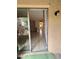 Open living room with tile flooring and sliding glass door that leads to the patio at 2733 Hidden Lake Blvd # A, Sarasota, FL 34237