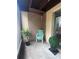 Cozy patio with lattice design, chair, and potted plants, perfect for relaxing outdoors at 2733 Hidden Lake Blvd # A, Sarasota, FL 34237
