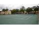 Well maintained community tennis courts with green surfaces and nets ready for play at 2733 Hidden Lake Blvd # A, Sarasota, FL 34237