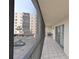 A condo balcony overlooks parking, palm trees and a neighboring building at 2901 26Th W St # 312, Bradenton, FL 34205