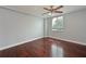 Cozy bedroom with hardwood floors, a ceiling fan, and a large window offering natural light at 2901 26Th W St # 312, Bradenton, FL 34205