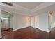 Bright living room with hardwood floors, white walls, and white door closets providing ample storage space at 2901 26Th W St # 312, Bradenton, FL 34205