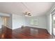 Spacious living room with hardwood floors, a ceiling fan, and large windows for plenty of natural light at 2901 26Th W St # 312, Bradenton, FL 34205