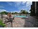 A beautiful community pool area with lounge chairs, tables, and umbrellas for a relaxing outdoor experience at 2901 26Th W St # 312, Bradenton, FL 34205