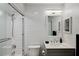 Nicely tiled bathroom featuring a shower-over-tub, sink with chrome fixtures, and light gray vanity at 3006 Wister Cir, Valrico, FL 33596