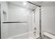Clean bathroom features white tiled walls, a shower, and glass door at 3006 Wister Cir, Valrico, FL 33596
