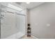 Modern bathroom featuring glass shower, skylight, and neutral paint at 3006 Wister Cir, Valrico, FL 33596