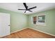 This simple bedroom has a window for light and wood floors to add a touch of class at 3006 Wister Cir, Valrico, FL 33596