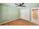 This simple green bedroom has hardwood floors and closet space, allowing you to move right in at 3006 Wister Cir, Valrico, FL 33596
