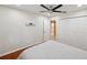 Bedroom with hardwood floors, ceiling fan, access to hall and closet at 3006 Wister Cir, Valrico, FL 33596