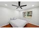 This bedroom is naturally lit and features red oak floors to compliment the white walls at 3006 Wister Cir, Valrico, FL 33596