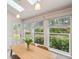 Dining area featuring large windows offering views of the private backyard at 3006 Wister Cir, Valrico, FL 33596