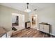 Inviting dining area with wood floors and stylish lighting, flowing into living spaces at 3006 Wister Cir, Valrico, FL 33596