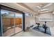 Bright exercise room with sliding glass doors that lead to a private, fenced-in backyard at 3006 Wister Cir, Valrico, FL 33596