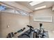 Well-lit exercise area featuring fitness equipment and natural light from multiple skylights at 3006 Wister Cir, Valrico, FL 33596