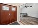 Inviting foyer with beautiful flooring, a stylish door and a glimpse of the living room at 3006 Wister Cir, Valrico, FL 33596