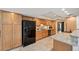 Well-lit kitchen featuring sleek appliances, granite countertops, and ample cabinet space at 3006 Wister Cir, Valrico, FL 33596