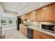 Well-lit kitchen with modern appliances, granite countertops, and an inviting atmosphere at 3006 Wister Cir, Valrico, FL 33596