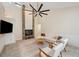 Open living room boasts stone fireplace, cathedral ceilings, modern fan, and comfortable seating at 3006 Wister Cir, Valrico, FL 33596