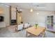 Open living room with skylights, a vaulted ceiling, and a cozy dining area at 3006 Wister Cir, Valrico, FL 33596