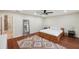 Spacious main bedroom featuring hardwood floors, a large mirror, and neutral decor at 3006 Wister Cir, Valrico, FL 33596