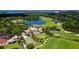 A stunning aerial view of the golf course, clubhouse and lake highlighting this luxury community at 33 Bishops Court Rd # 118, Osprey, FL 34229