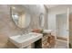 Bright bathroom with dual sinks, tiled shower and vanity offers space and comfort at 33 Bishops Court Rd # 118, Osprey, FL 34229